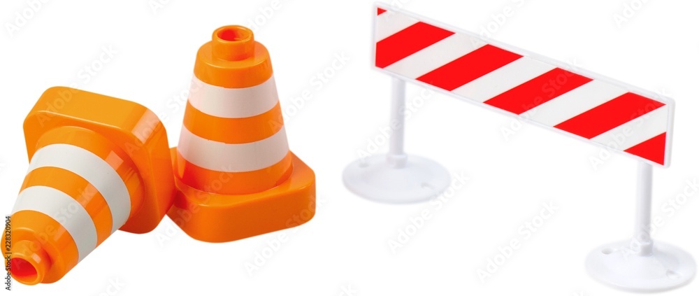 Close-up photo of yellow and red road signs isolated on white