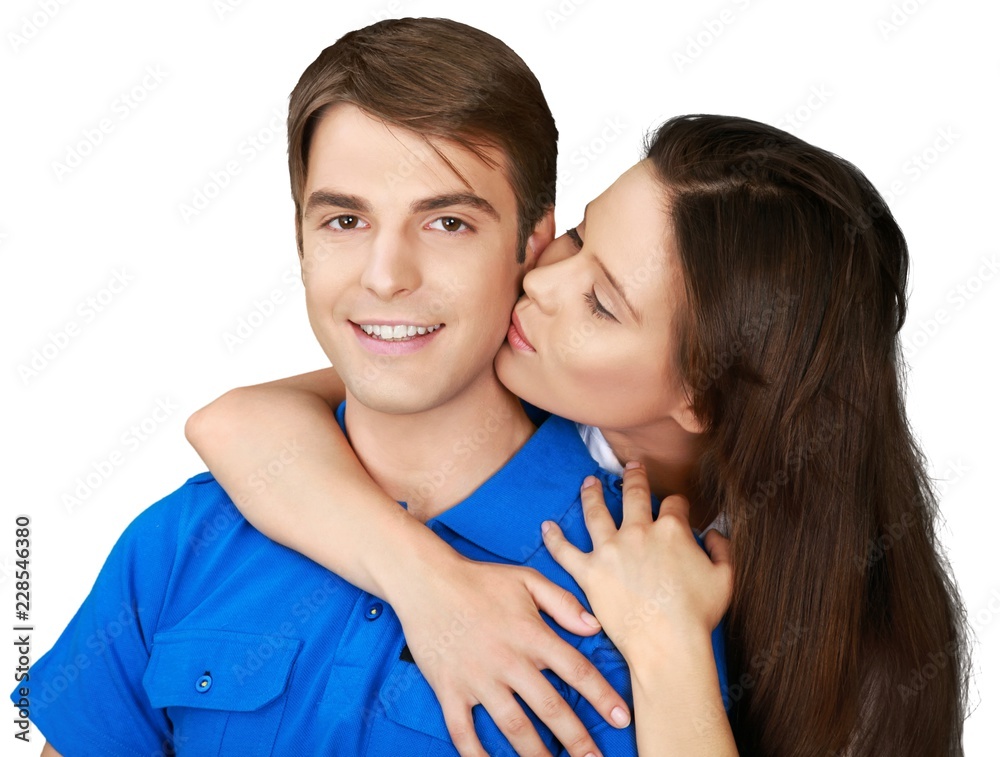 Beautiful Woman Kissing a Young Man On Cheek - Isolated