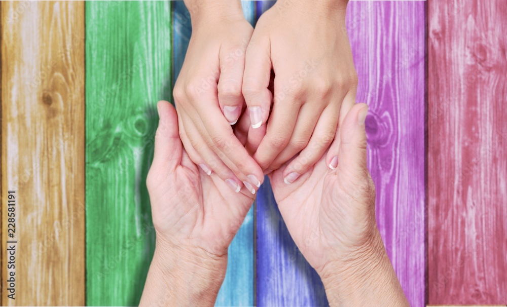 Hands of the old man and woman hand