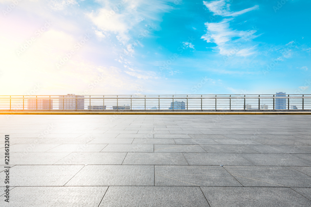 Panoramic skyline and buildings with empty concrete square floor