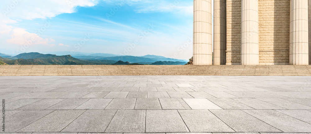 Empty square floor and modern architecture with mountain natural scenery