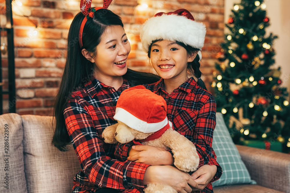 young mother hugging daughter with love