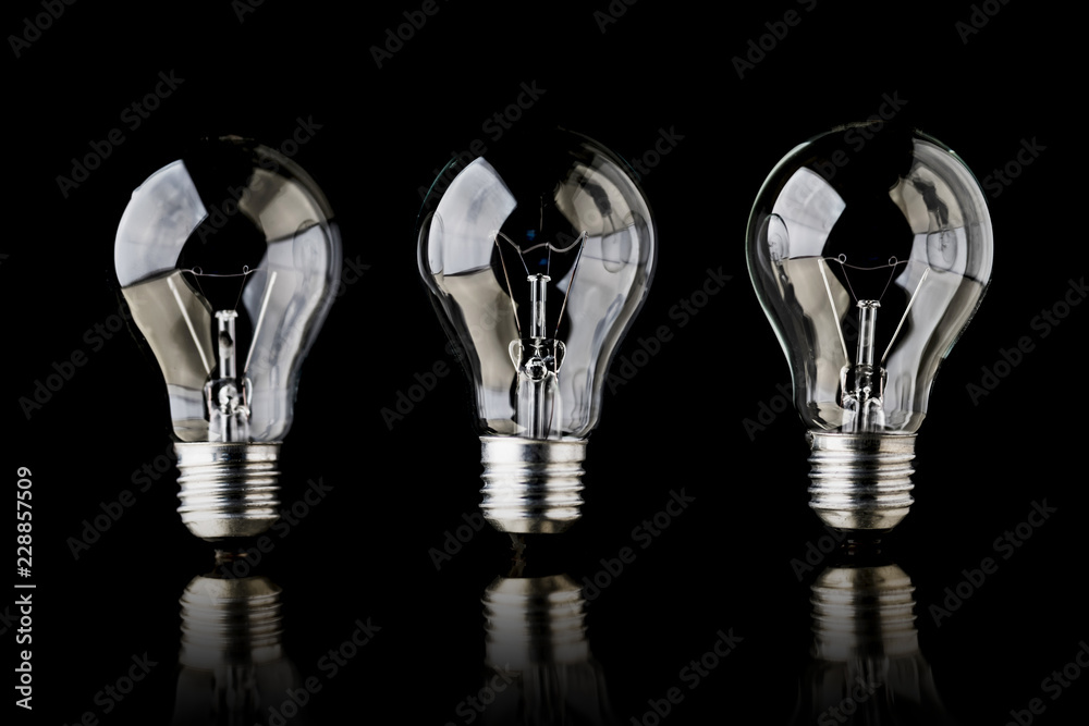 creativity startup business ideas concept with glow light bulb on black background