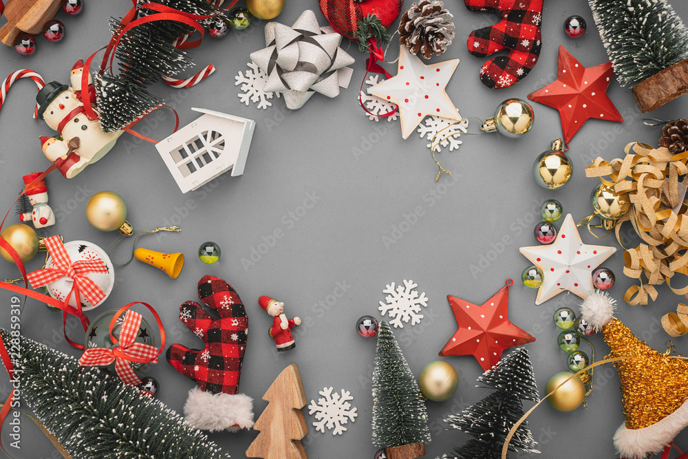 festive celebration background with christmas decorating items on color paper background with free c