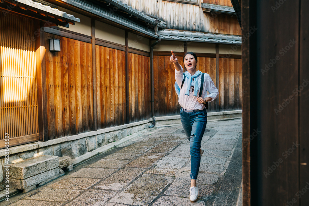 traveler excited and pointing to the temple