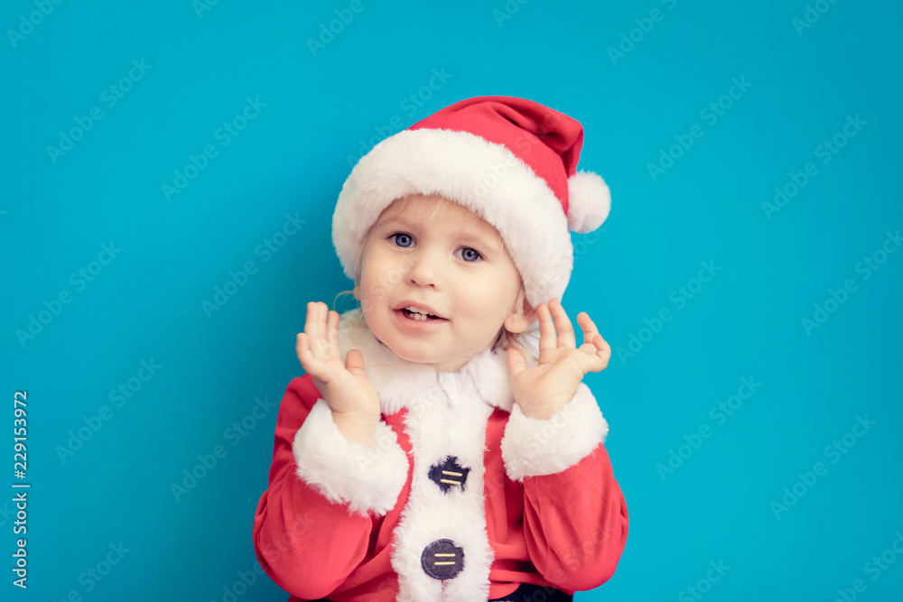 Portrait of child wearing Santa Claus costume