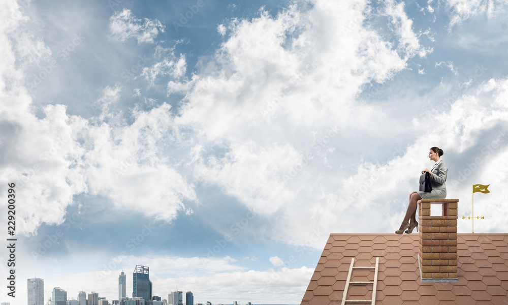 Businesswoman or accountant on house roof floating high above mo