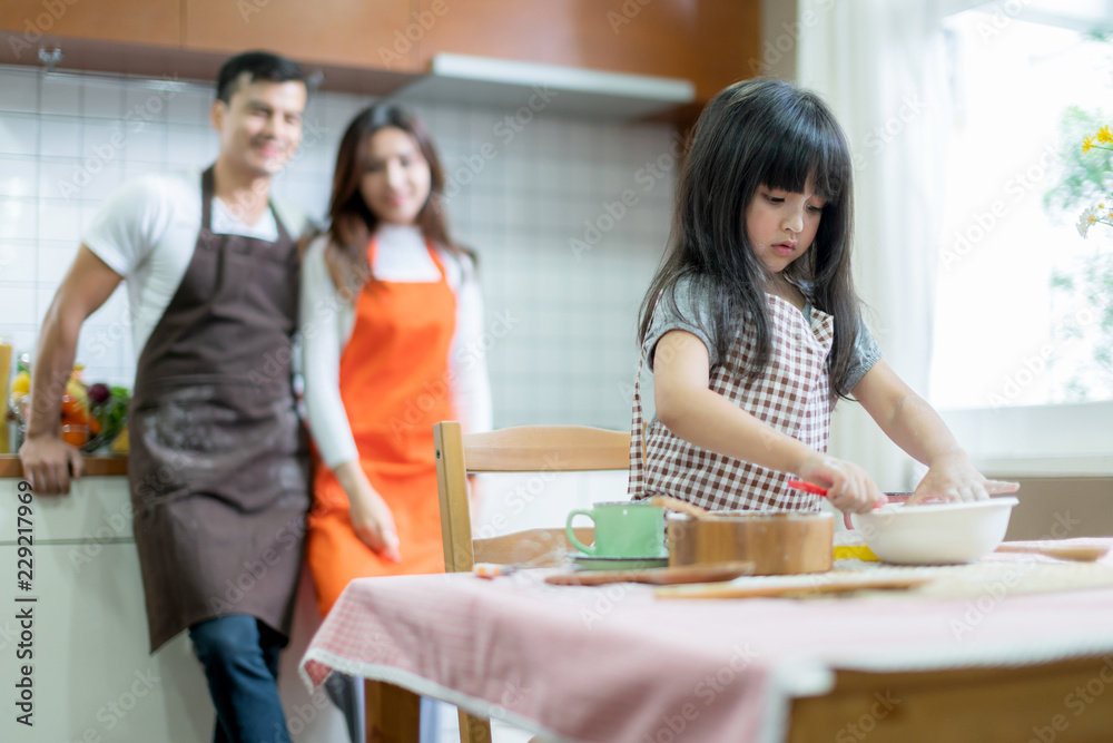 sweet family weekend activities cooking together with dad mom and daughter happiness moment and joyf