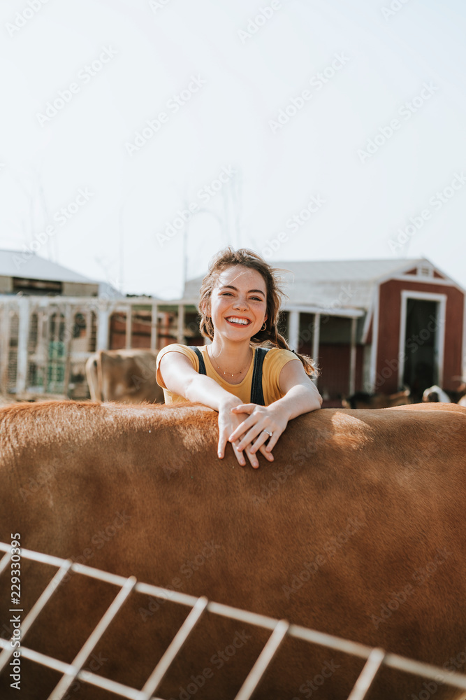 Cheerful woman having fun at the farm