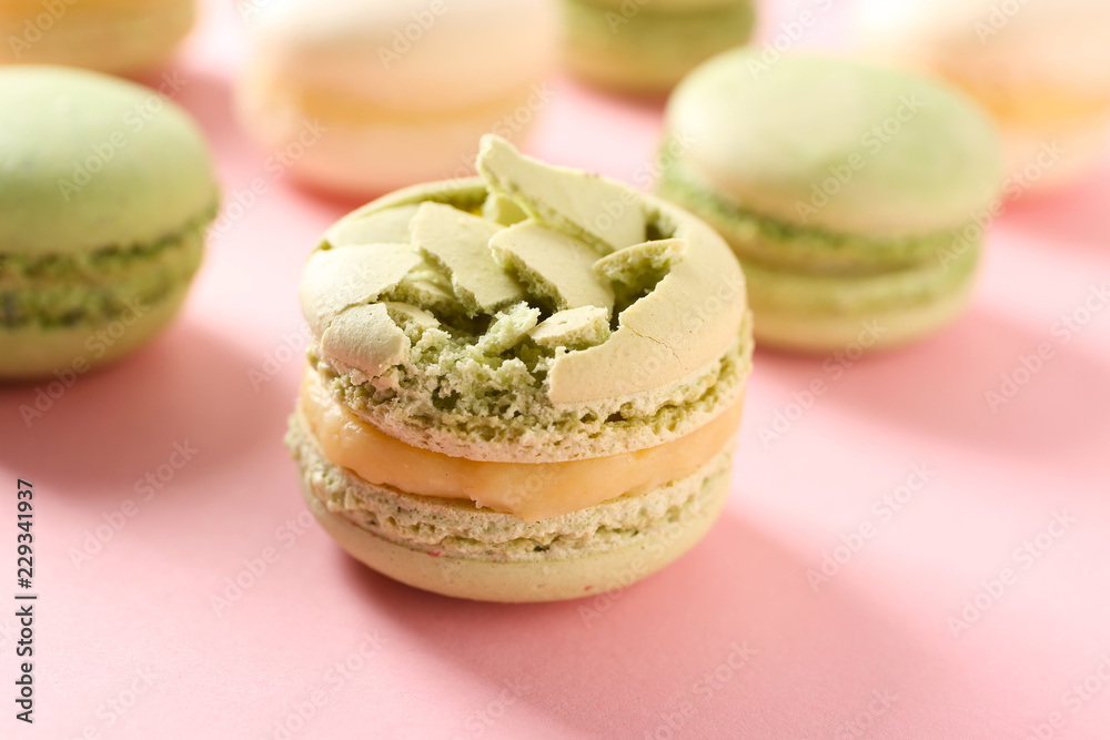 Sweet crushed macaroon on color background