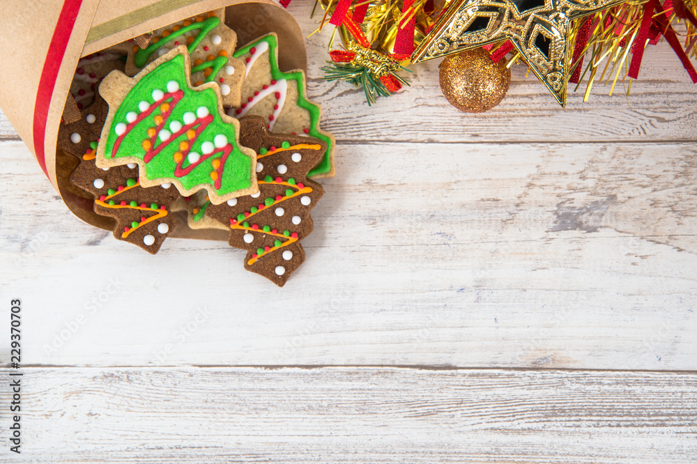 Beautiful Christmas composition and decoration with baked Christmas gingerbread cookie in paper bag 