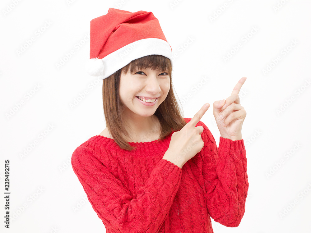 女性　クリスマス　指差し