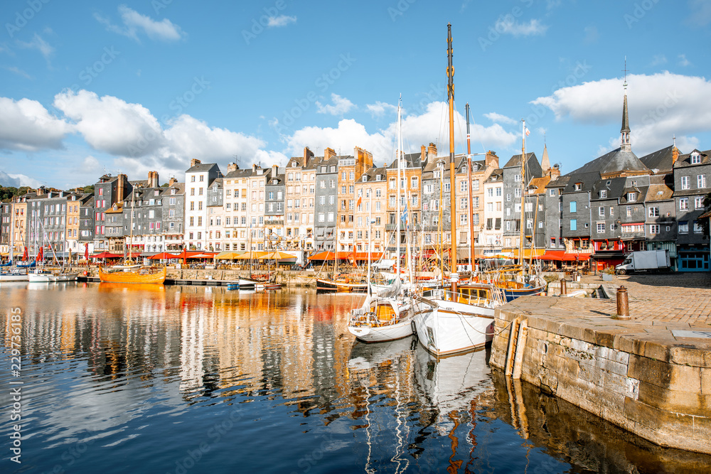 Landscape view of the harbour in Honfleur, famous french town in Normandy, during the morning light