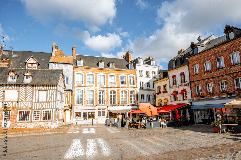 Beautiful facades of the old buildings in the central square in Honfleur, famous french town in Norm