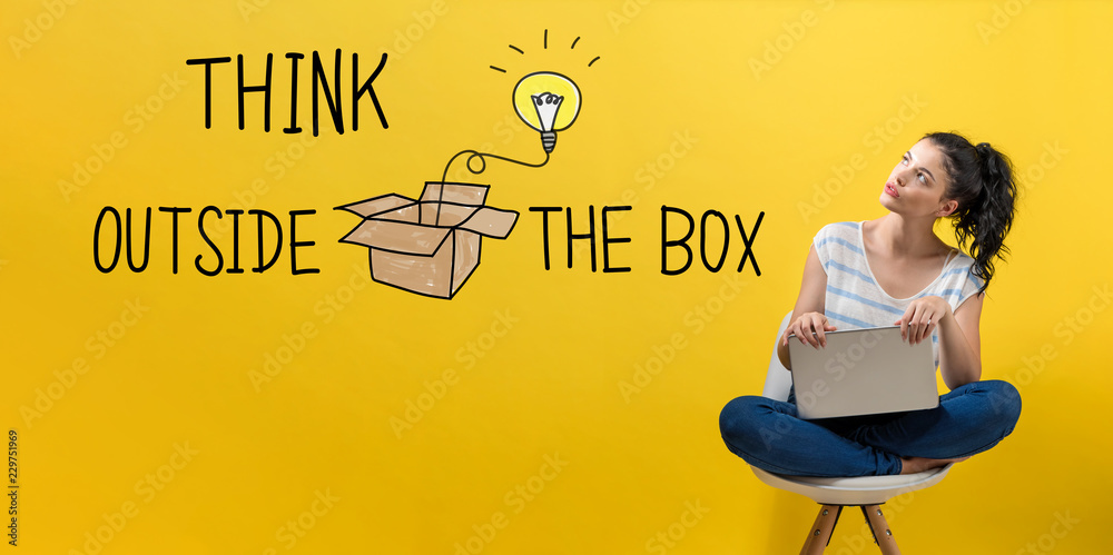 Think outside the box with young woman using a laptop computer 