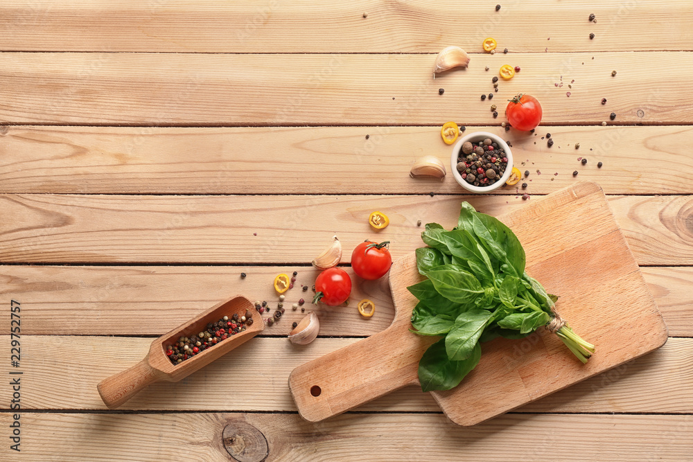 Flat lay composition with spices and herbs on wooden background