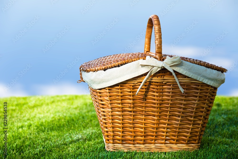 Picnic Basket with napkin on nature background