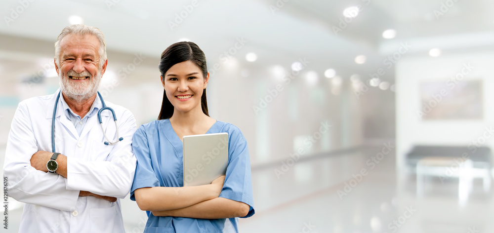 Senior and young doctor working in the hospital.