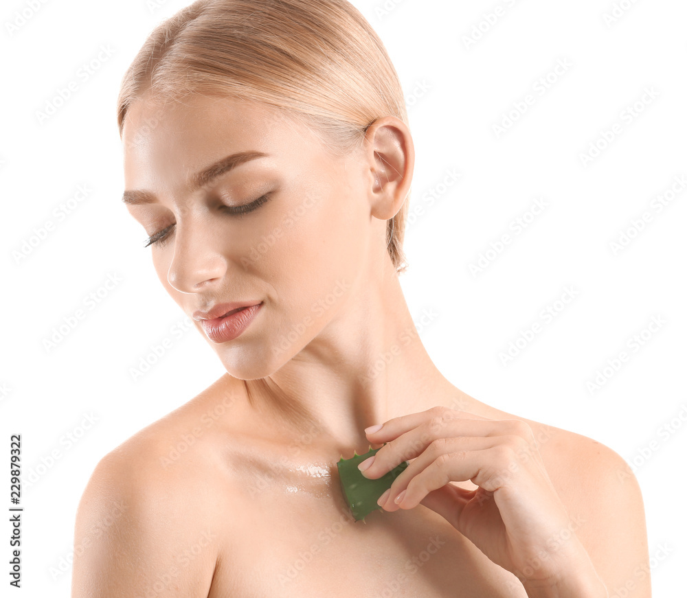 Beautiful young woman with aloe vera on white background