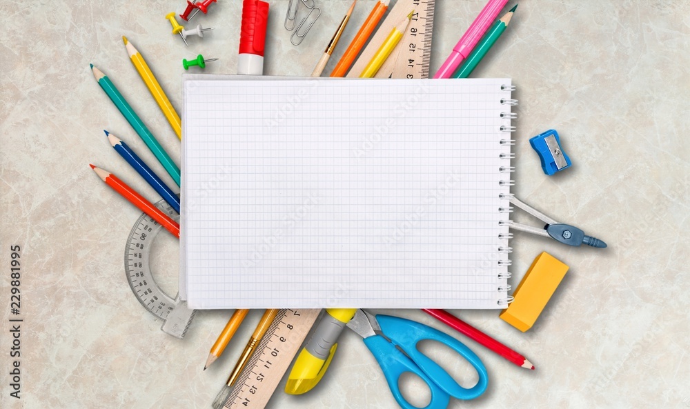 Colorful school supplies on white background