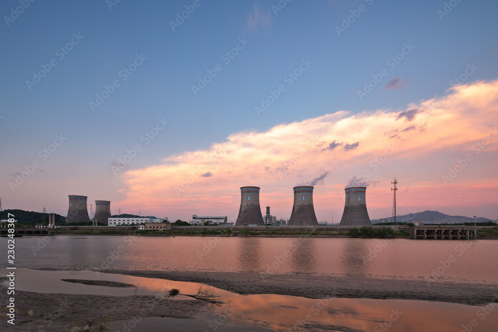 power plant with sunset