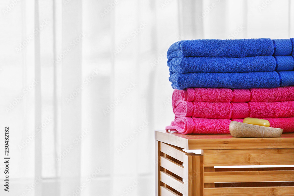 Color terry towels on wooden table