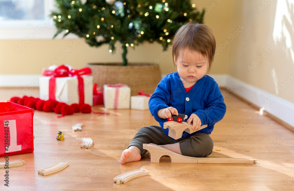 Toddler boy in his house around Christmas time