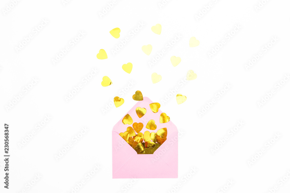 Composition with pink envelope and golden confetti on white background. Flat lay, top view.