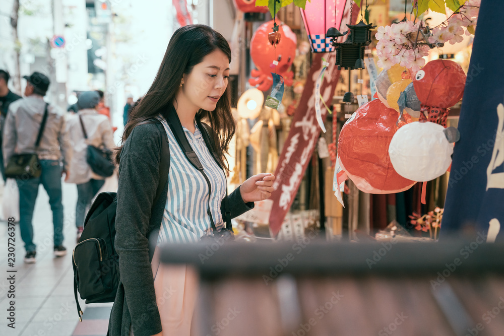 woman enjoy the beauty of the lantern shop.