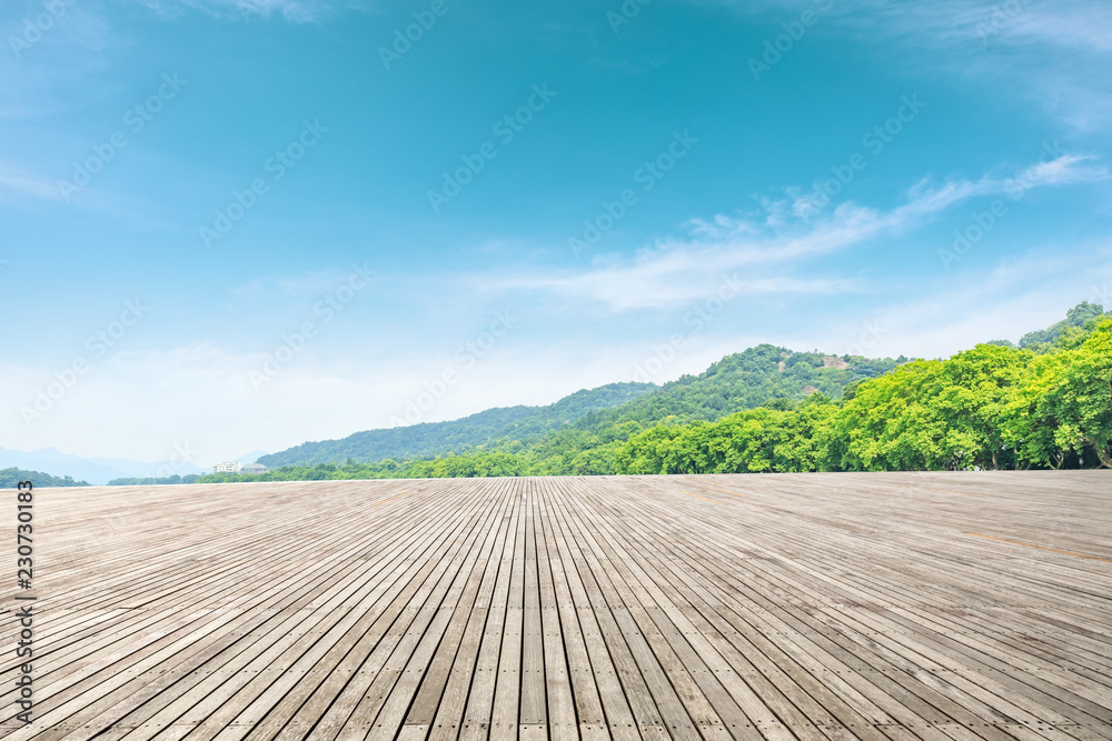 Empty wooden platform and beautiful mountain