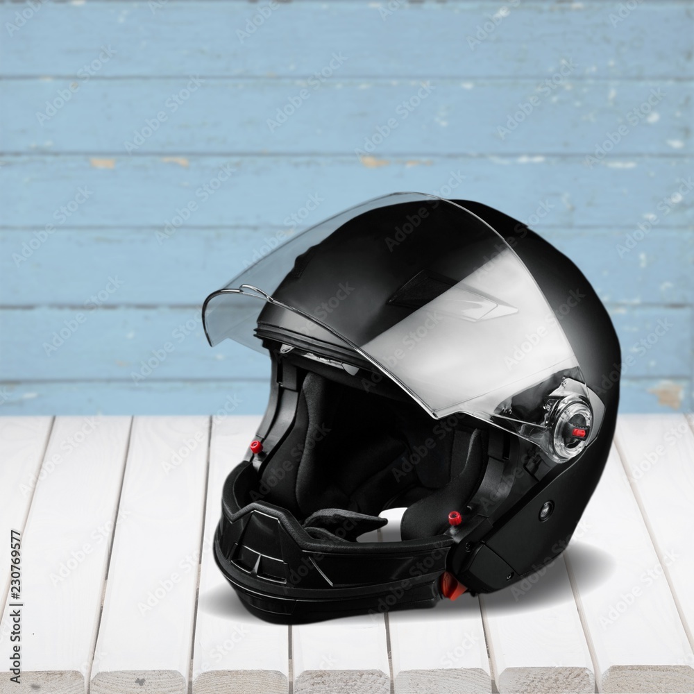 Black biker helmet isolated on white background