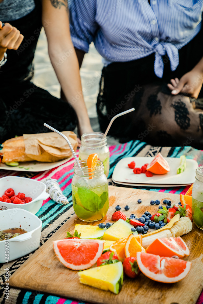 Fresh fruits on a wooden board at a picnic