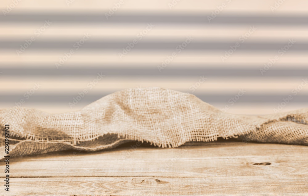 Burlap texture on wooden table on blurred