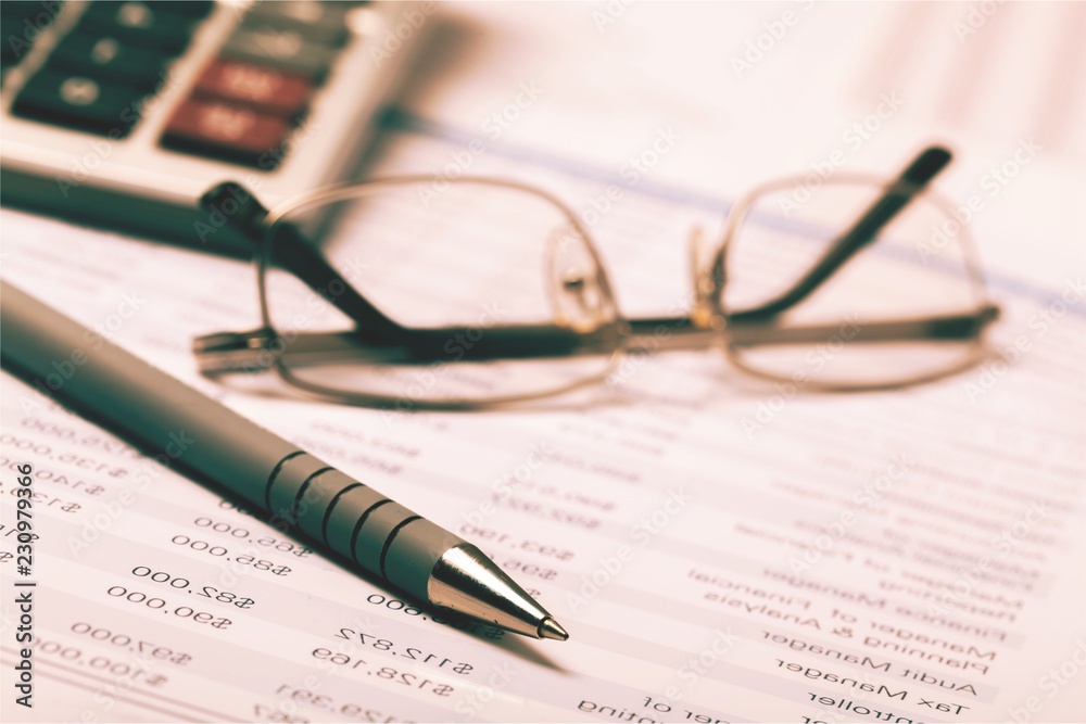 Close-up image of an office desk at morning with a cup of tea