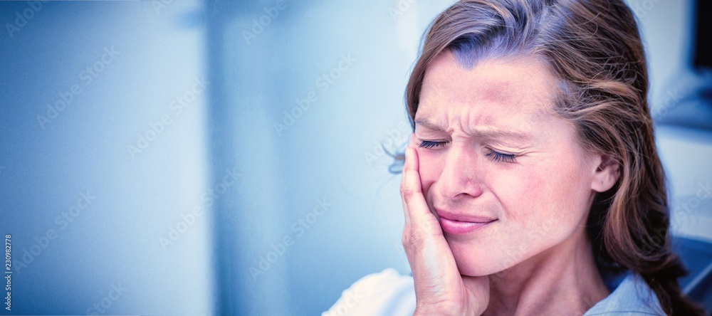 Unhappy woman having a toothache