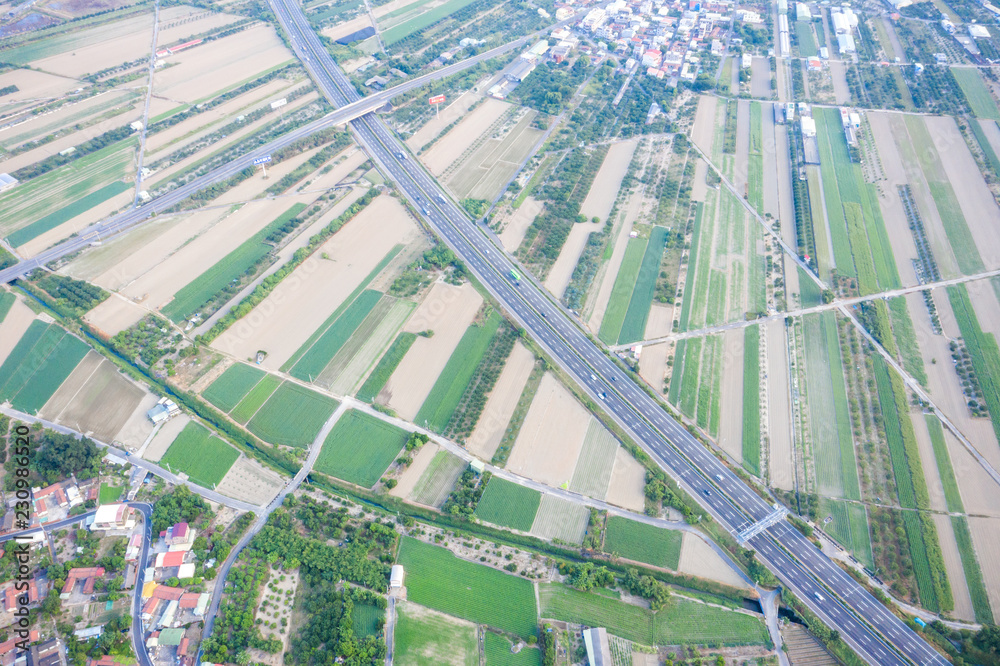 Fields with various types of agriculture and villages beside with air pollution in winter morning, T