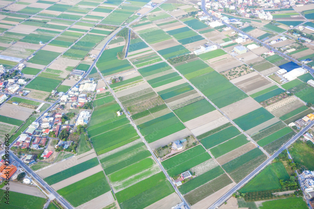 Fields with various types of agriculture and villages beside with air pollution in winter morning, T