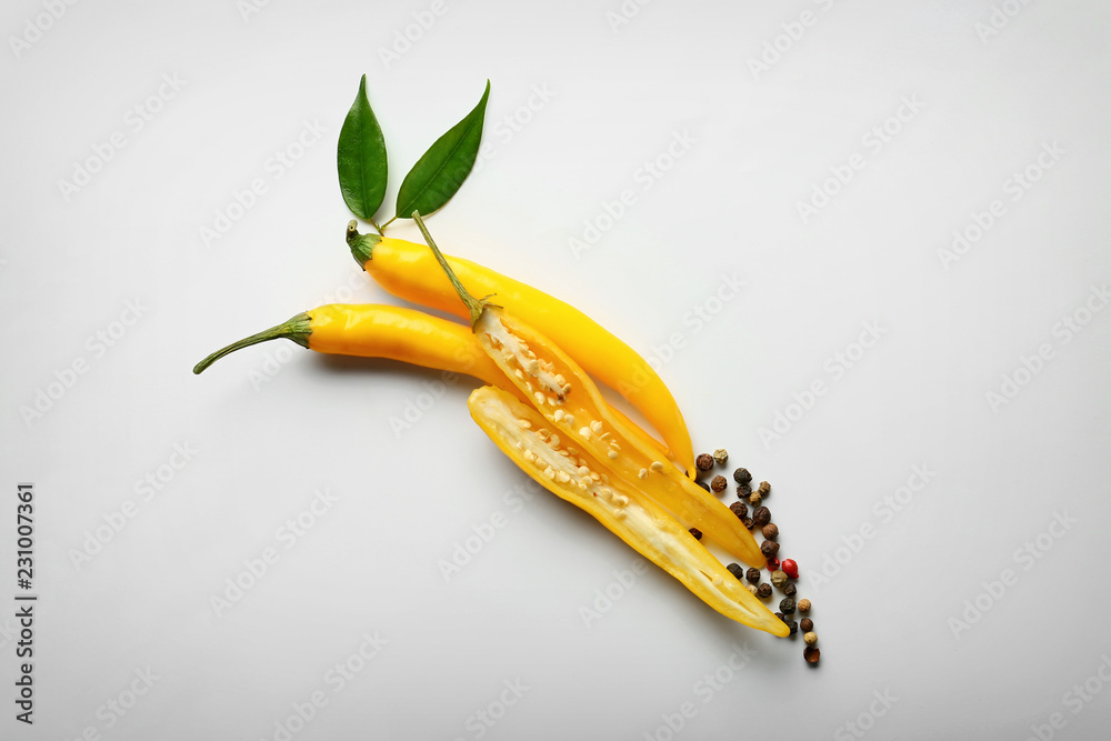 Yellow chili peppers on white background