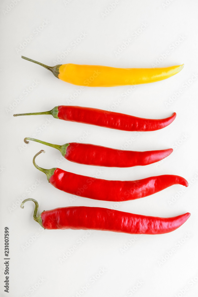 Fresh chili peppers on light background