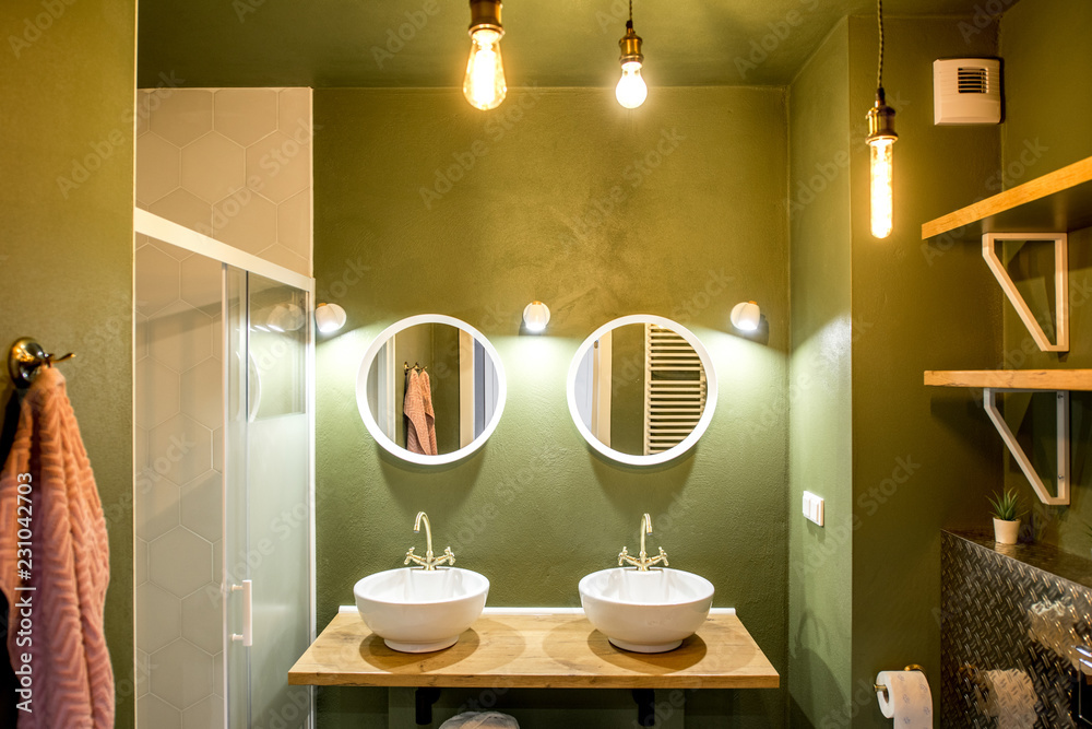 Modern loft bathroom made in green and white colors with retro plumbing elements