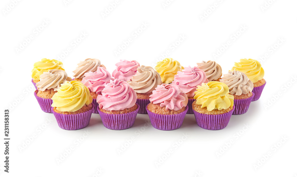 Delicious cupcakes on white background