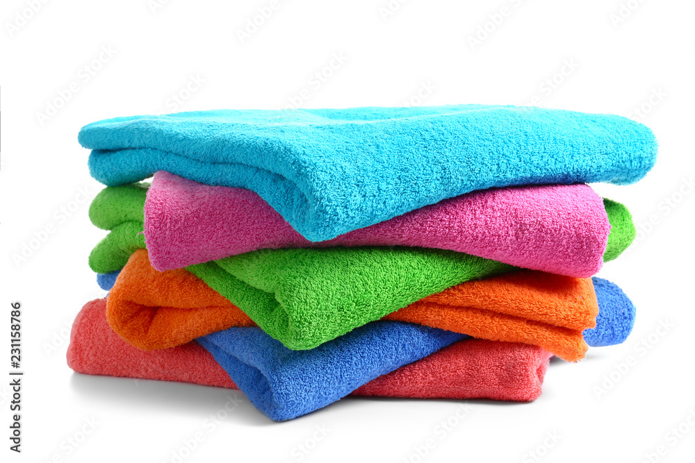 Stack of clean soft towels on white background