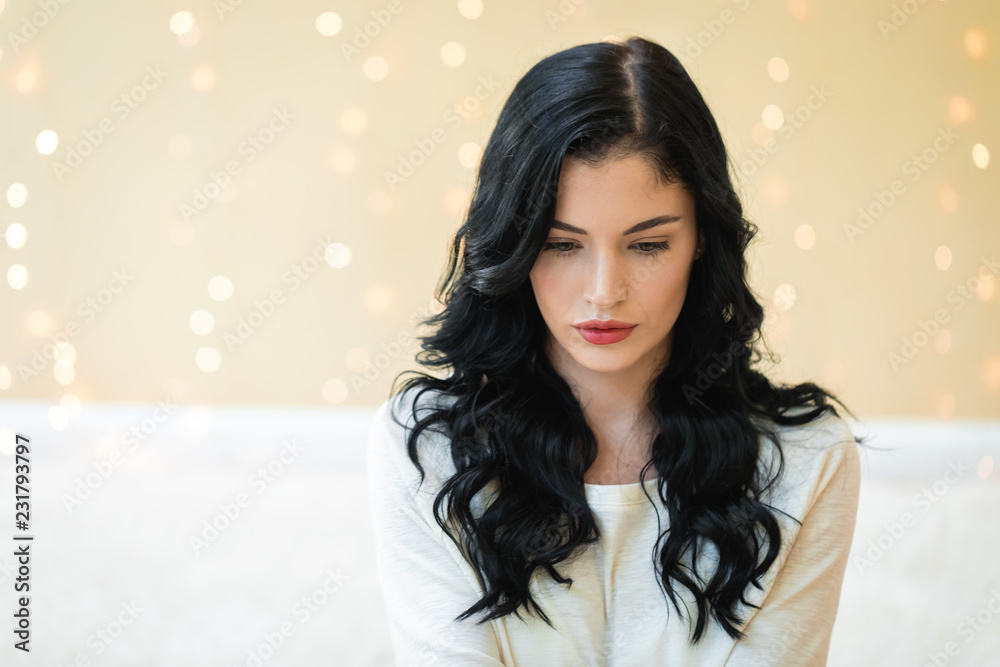 Portrait of a young woman in her home