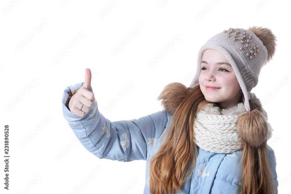 Portrait of a little girl in warm clothes on white background