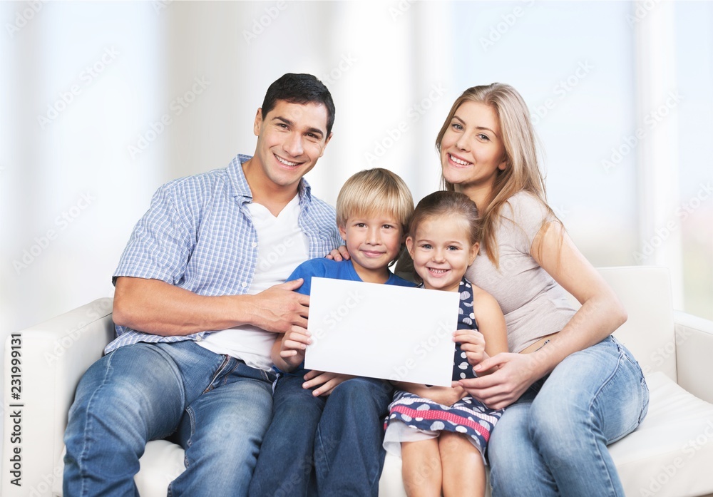 Beautiful smiling family in room at home