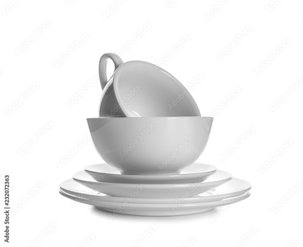 Set of clean tableware on white background