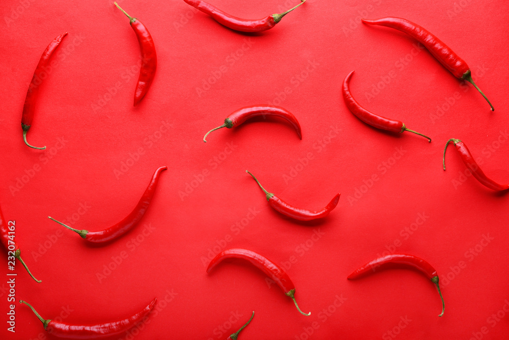 Fresh chili peppers on color background