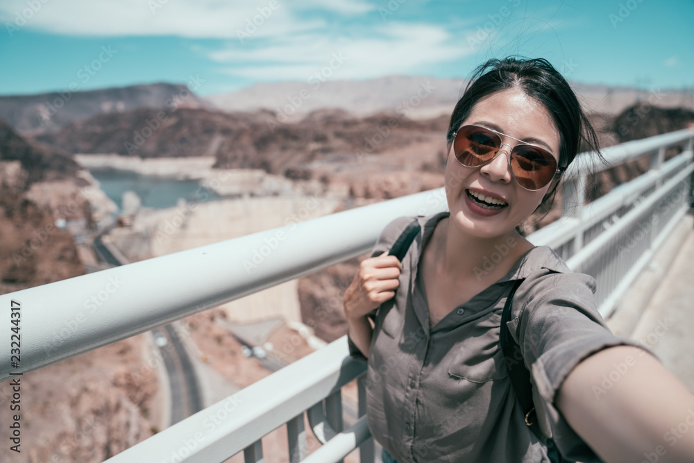 traveler with sunglasses taking self portrait