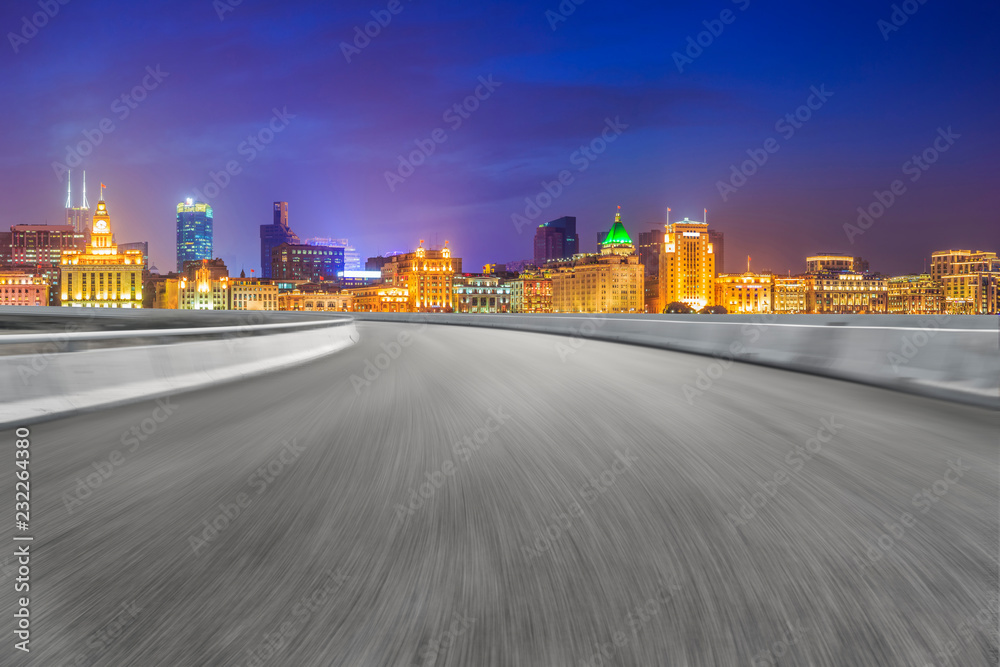 Empty asphalt road along modern commercial buildings in Chinas cities