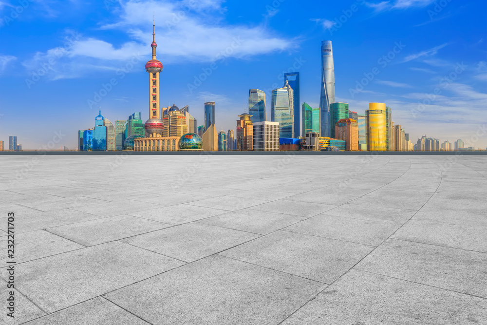 Blue sky, empty marble floor and skyline of Shanghai urban architecture.